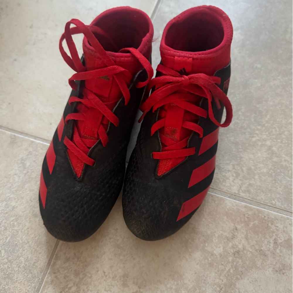 Adidas Kids soccer cleats in Black and Red
